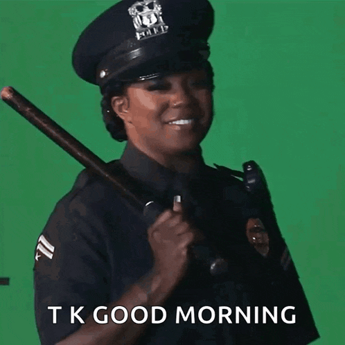 a woman in a police uniform is holding a baton and the words tk good morning are below her