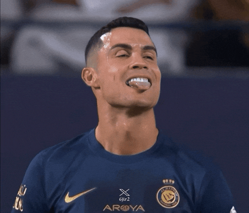 a soccer player wearing a shirt that says aroya