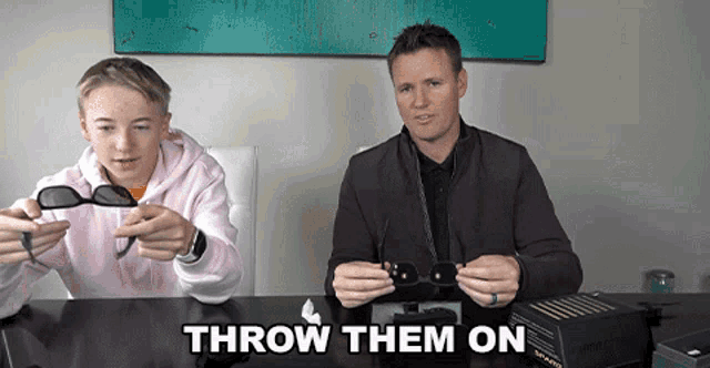 a man and a boy sitting at a table with the words " throw them on " on the top