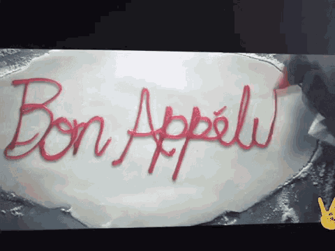 a piece of dough with the word bon appelu written on it
