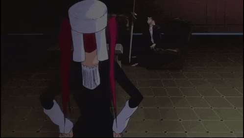 a girl with red hair is making a funny face while a man sits behind her