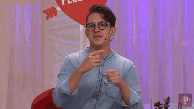 a man wearing glasses and a name tag that says emilie