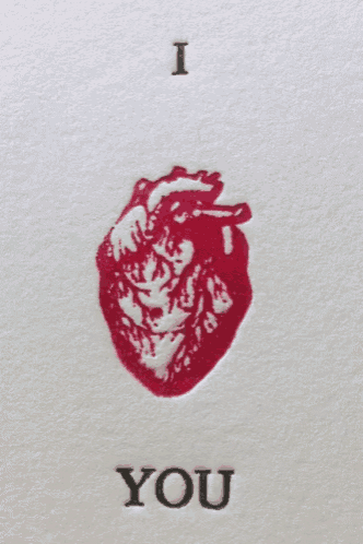 a white card with a red heart and the words i love you