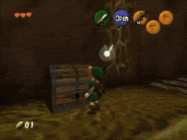 a video game character is standing in front of a box with a light coming out of it .