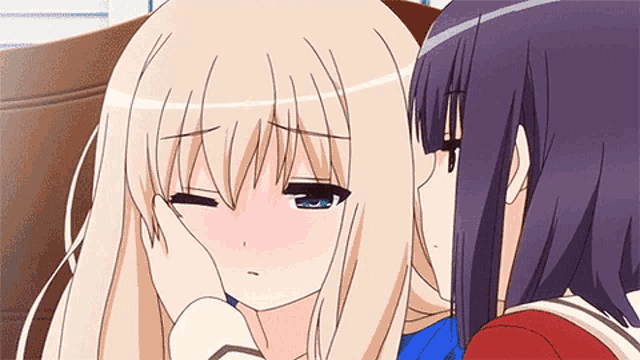 two anime girls are sitting next to each other and one of them is making a funny face
