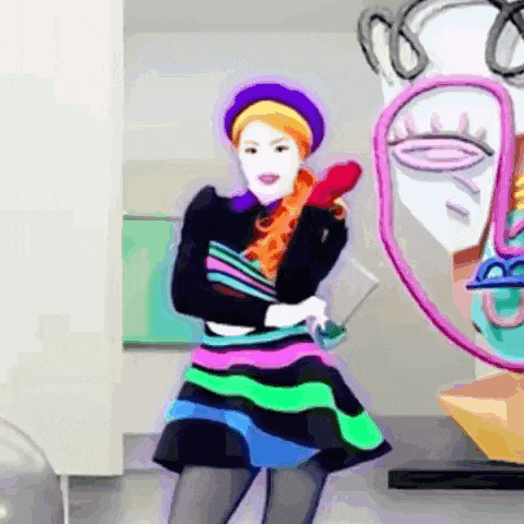 a woman is dancing in front of a painting of a face