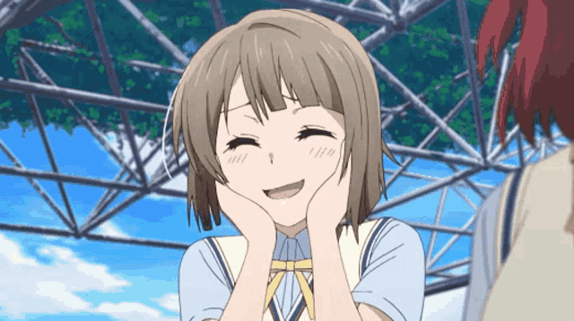 a girl with short hair is smiling and holding her face with her hands