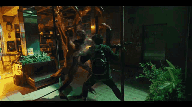 a man with a backpack is holding a bat in his hand