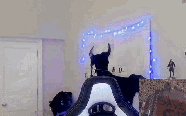 a room with a statue of a bull and a sign that says save on it