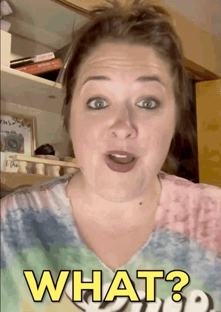 a woman with a surprised look on her face says " what "