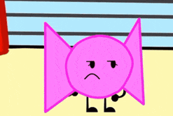 a pink candy with a sad face on it