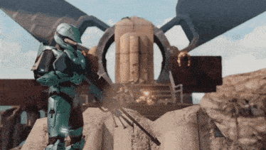 a man in a green armor holding a rifle