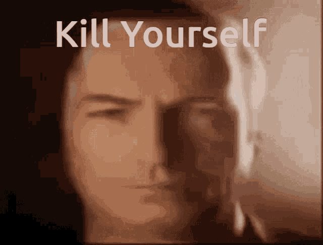 a blurred image of a man 's face with the words kill yourself above him