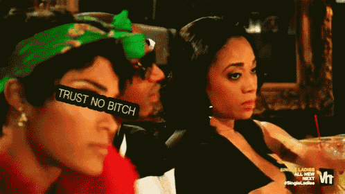 a woman with sunglasses that say trust no bitch