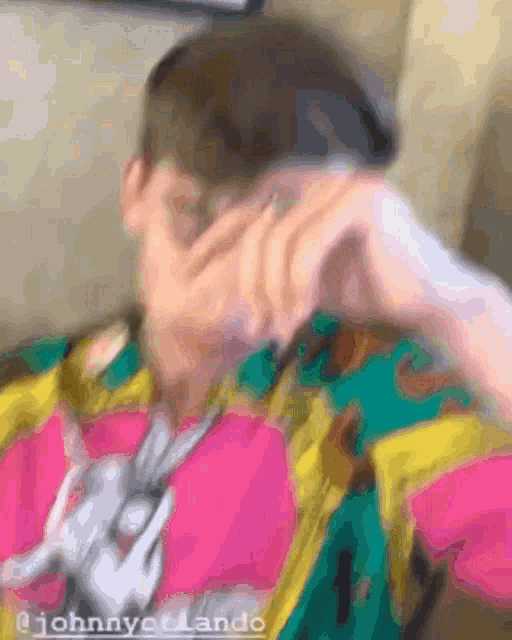 a blurry photo of a person with the name johnny on the bottom