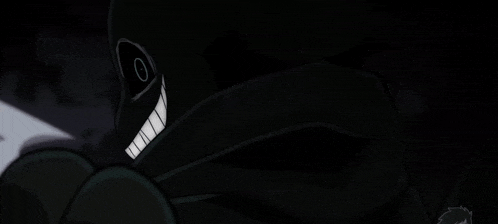 a person holding a knife in their hand in the dark