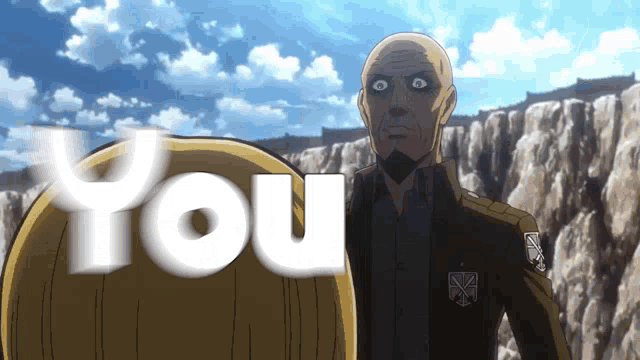 a bald man with a beard stands in front of a cliff with the word you behind him
