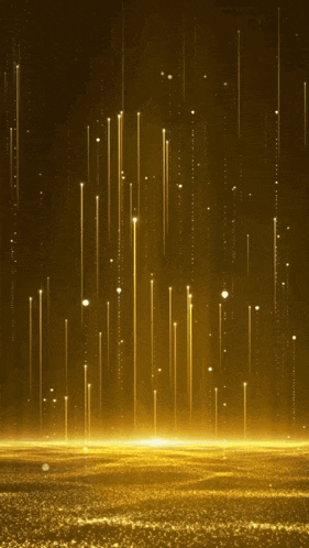 a dark background with a lot of gold sparkles coming out of it