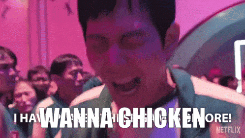 a man is screaming in front of a crowd of people and saying `` i wanna chicken or ! ''