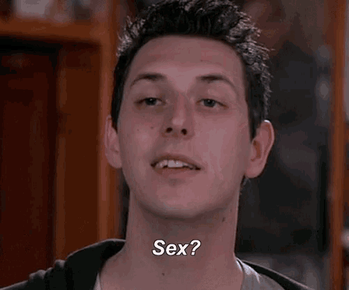 a young man is smiling and asking a question about sex .