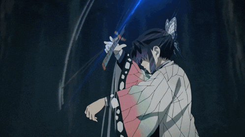 a woman in a kimono is holding a sword in her hand