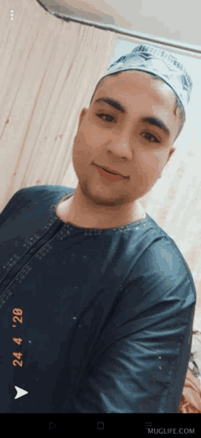 a man taking a selfie with a time stamp of 4:24