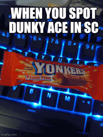 a computer keyboard with a peanut power yonkers bar on top of it