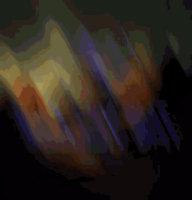 a blurry picture of a dark background with a yellow and purple gradient