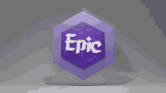 a purple diamond is floating on a gray surface .