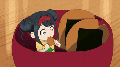 a little girl is eating a piece of food in a bowl