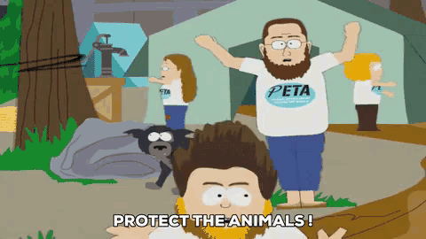 a man with a beard wearing a shirt that says peta