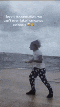 a person is dancing in the rain with a caption that says " i love this generation we can 't even take hurricanes seriously