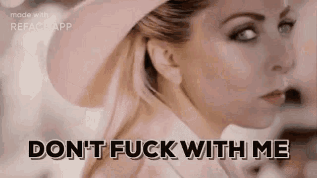 a woman is wearing a pink hat and a pink coat and says `` don 't fuck with me '' .