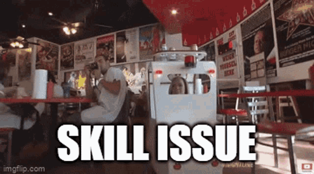 a man sits at a table in a diner with the words skill issue written on the bottom
