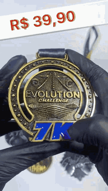 a person holding a gold medal that says evolution challenge