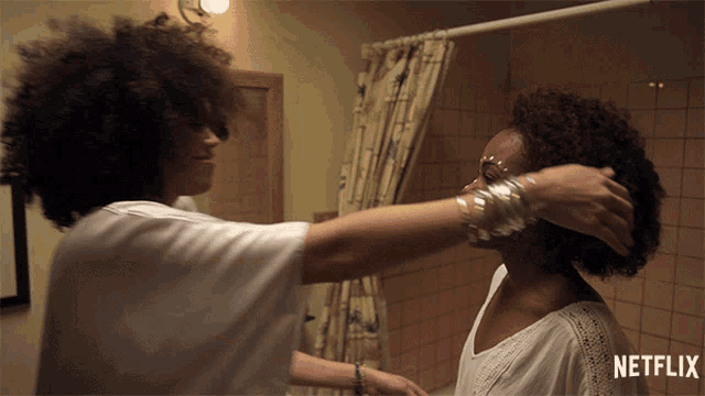 a netflix ad shows a woman touching another woman 's hair