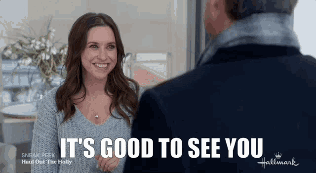 a woman is smiling and talking to a man with the words it 's good to see you