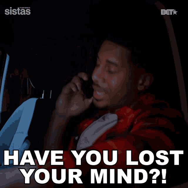 a man sitting in a car talking on a cell phone with the words have you lost your mind