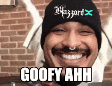 a man wearing a black beanie says goofy ahh on his face