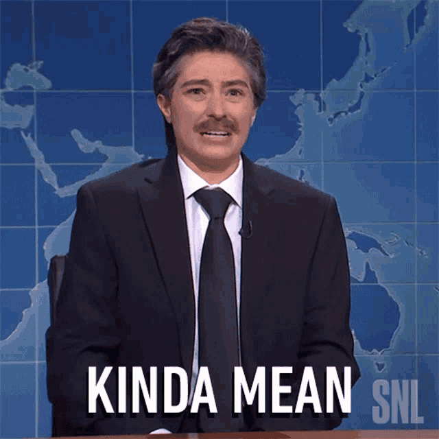 a man in a suit and tie says kinda mean on snl