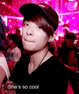 a girl wearing a baseball cap with the word vision on it