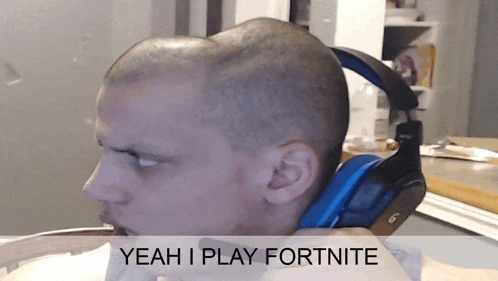 a man wearing headphones with the words yeah i play fortnite on the bottom