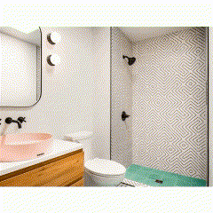 a bathroom with a toilet , sink , and shower .