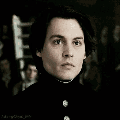 a close up of a man 's face with the words johnny depp gifs below it