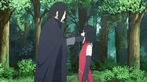 a man and a woman are standing in the woods and talking to each other .