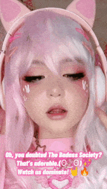 a girl wearing headphones and a pink wig says oh you doubted the badass society that 's adorable