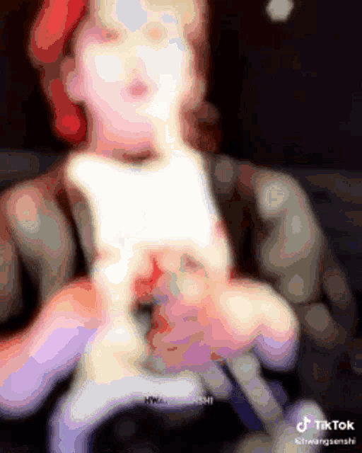 a blurry picture of a person holding something in their hands