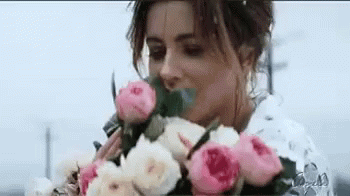 Woman Holding GIF - Woman Holding Bouquet GIFs