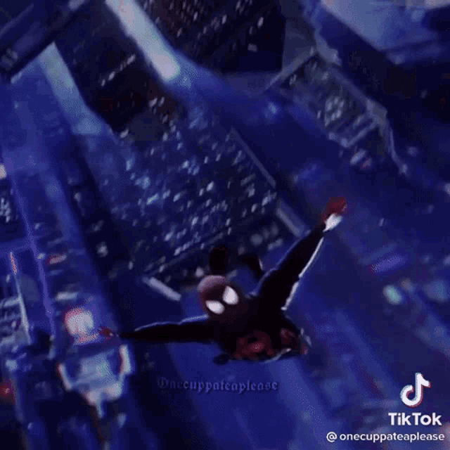 a person is flying through the air in a city .