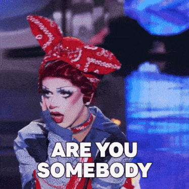 a drag queen says " are you somebody " while wearing a bunny ear headband